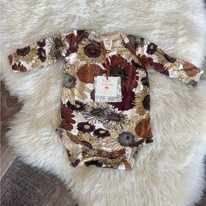 Kate Quinn sunflower onesie
